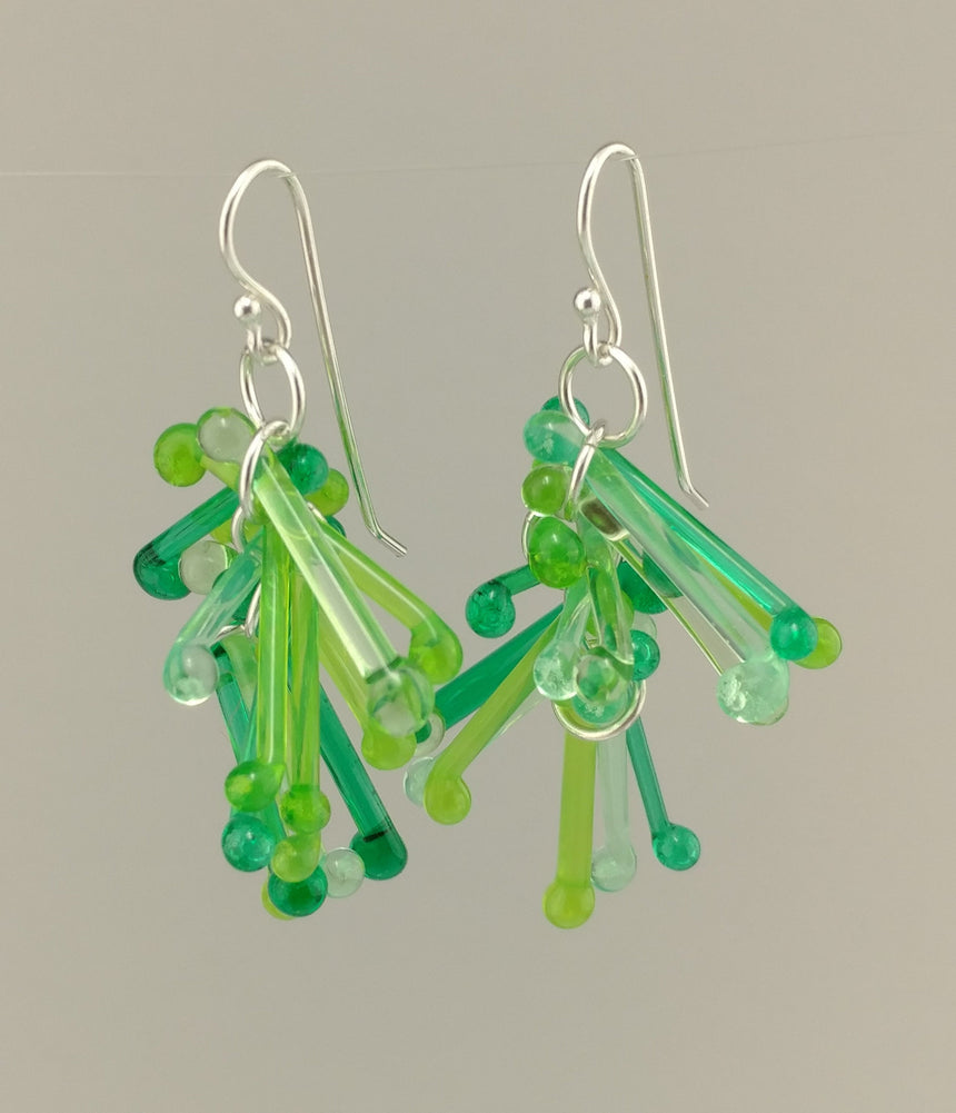 Shades of Green Kinetic Earrings of Lampwork Glass Jack with sterling silver ear wires.