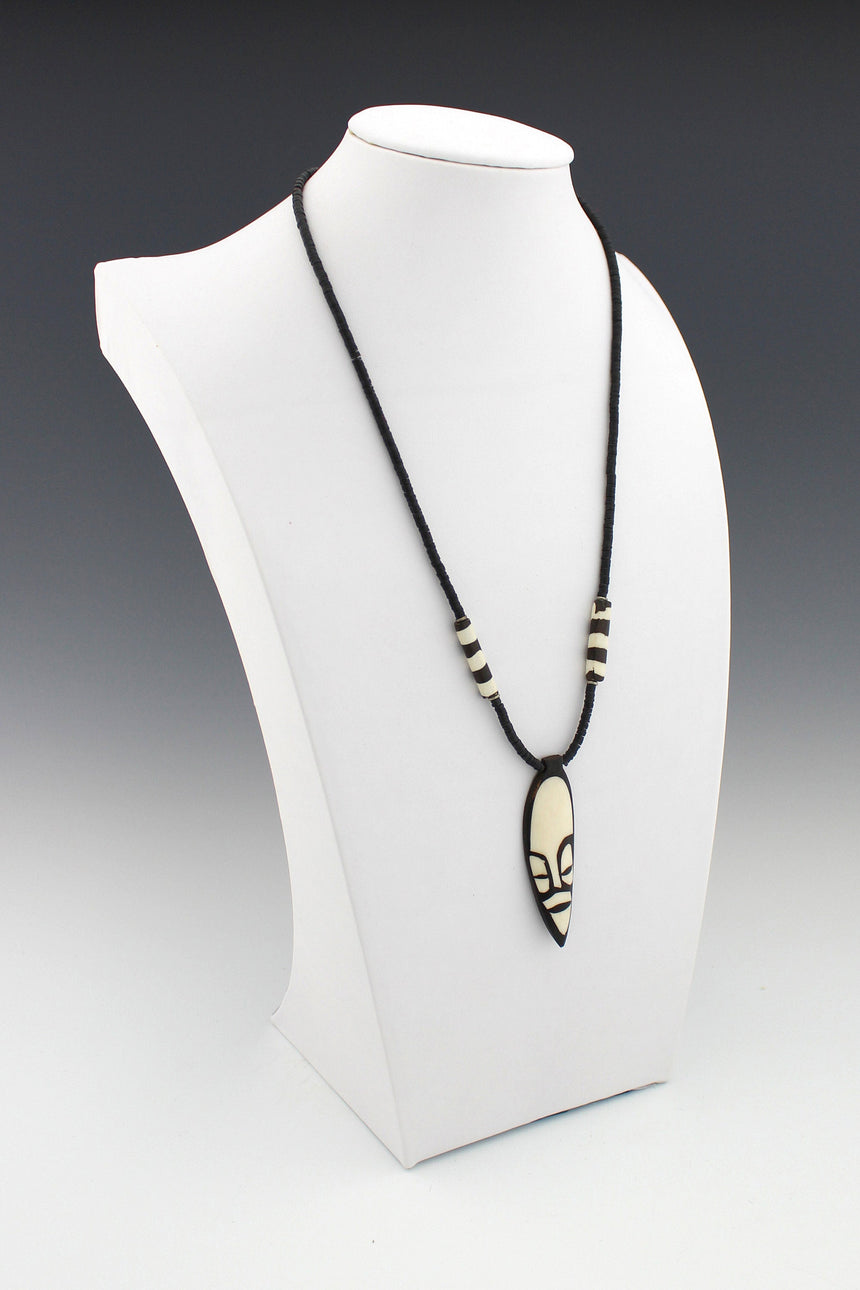 Black and White Carved Mask Pendant on tiny African Disk Bead Necklace