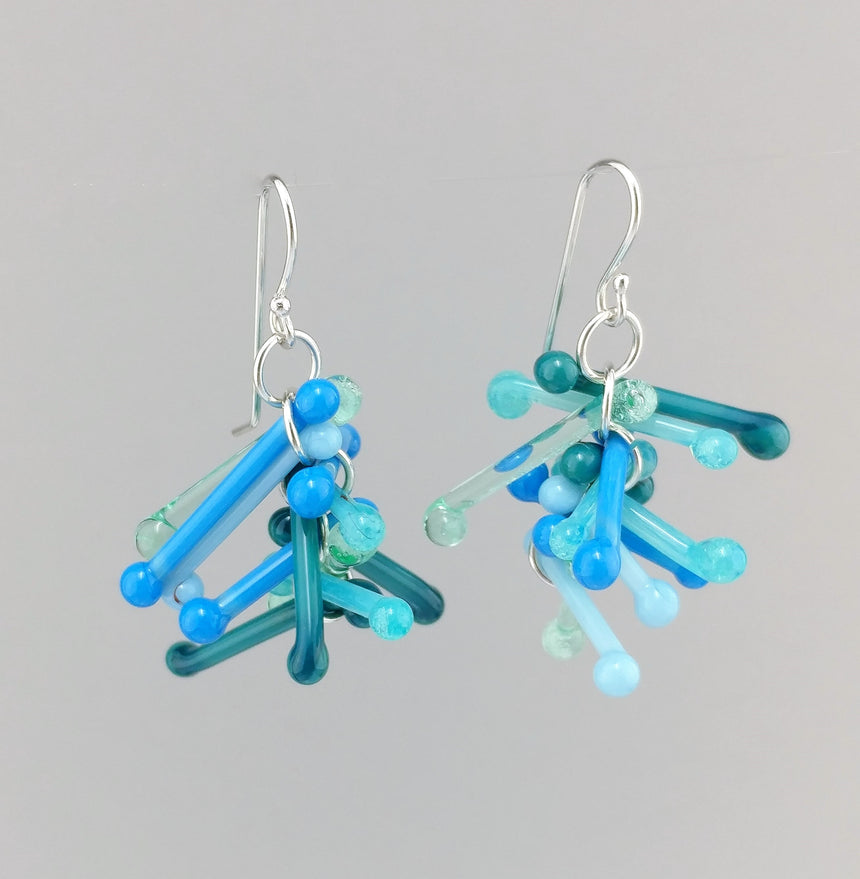 Shades of Turquoise Kinetic Earrings of Lampwork Glass Jack with sterling silver ear wires.