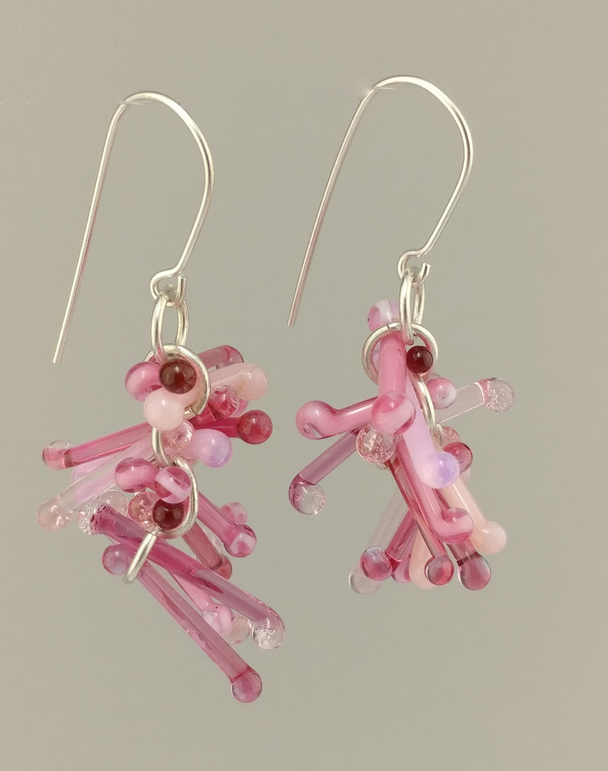 Shades of Pink Kinetic Earrings of Lampwork Glass Jack with sterling silver ear wires.