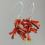 Shades of Red Kinetic Earrings of Lampwork Glass Jack with sterling silver ear wires.